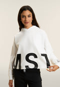 Oversize cropped mikina s kapucí a potiskem MST v bílé barvě
